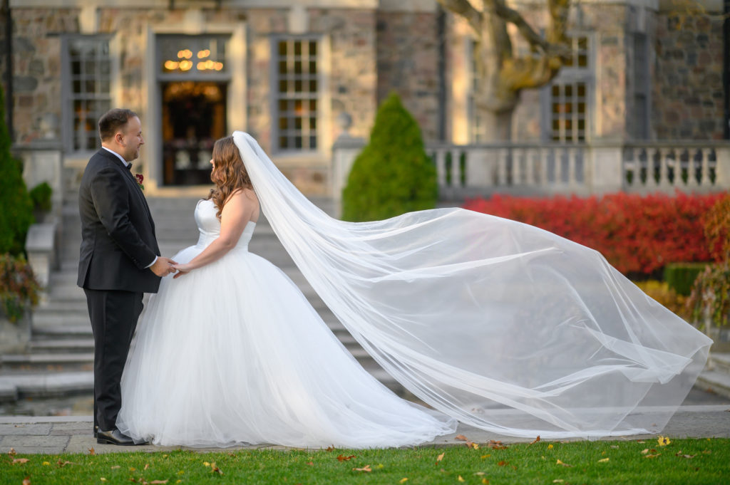 A Graydon Hall Wedding couple stand together during their winter wedding in Toronto
