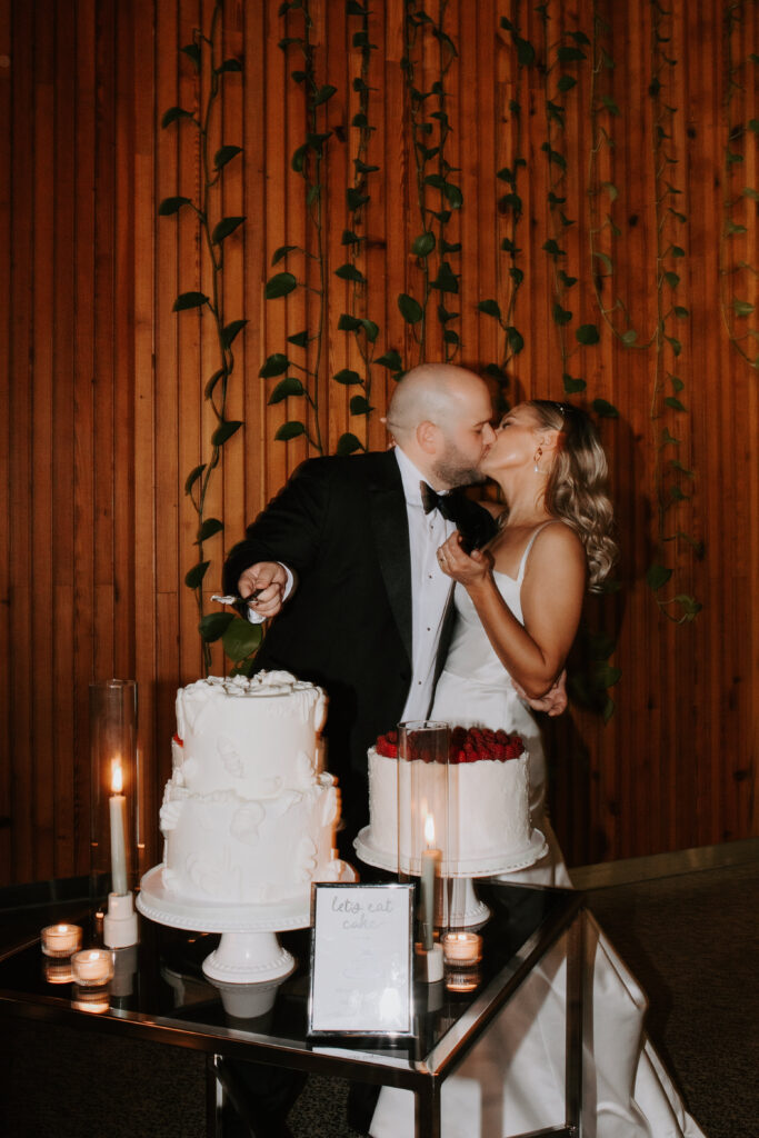 couple-cutting-their-cake-at-wedding-reception